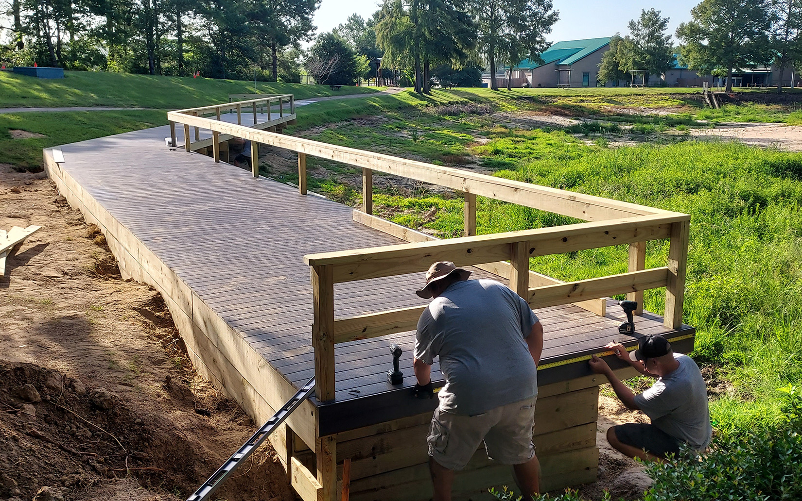 ‘IUEC Local 21’ Volunteers Rebuild Fishing Pier at Fisheries Center